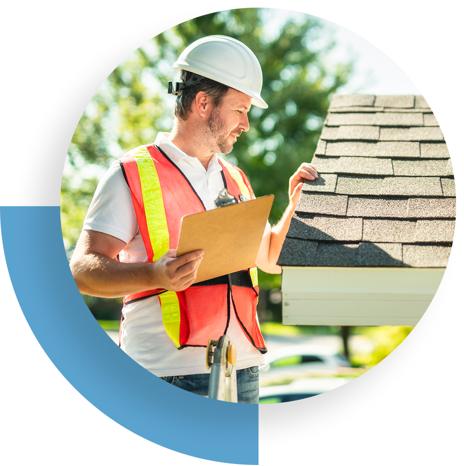 Construction worker with clipboard inspecting a roof outdoors.